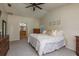 Spacious bedroom with high ceilings, carpet, and access to the Primary bathroom at 2800 Resnik W Cir, Palm Harbor, FL 34683