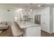 Bright kitchen featuring a large island with seating, stainless steel appliances, and ample cabinet space at 2800 Resnik W Cir, Palm Harbor, FL 34683