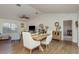 Open living space showcasing wood floors, high ceilings, and an adjacent dining area at 2800 Resnik W Cir, Palm Harbor, FL 34683