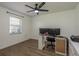 Office space with vinyl wood floors, bright white walls, and a ceiling fan at 2800 Resnik W Cir, Palm Harbor, FL 34683