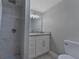 Bathroom features marble tile shower and updated vanity at 2812 Tom Brewer Ln, Plant City, FL 33566
