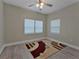 Bright bedroom featuring hardwood floors, neutral walls, and a ceiling fan at 2812 Tom Brewer Ln, Plant City, FL 33566