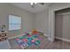 Cozy bedroom with natural light, wood floors, and ample closet space at 2812 Tom Brewer Ln, Plant City, FL 33566