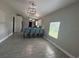 Bright dining area with a stylish light fixture and seating for four at 2812 Tom Brewer Ln, Plant City, FL 33566