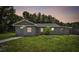 Charming single-story home with gray siding, well-maintained lawn, and inviting curb appeal at 2812 Tom Brewer Ln, Plant City, FL 33566