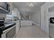 Spacious kitchen featuring modern appliances, granite countertops, and tile flooring at 2812 Tom Brewer Ln, Plant City, FL 33566