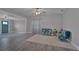 Bright living room features wood-look flooring and accent chairs at 2812 Tom Brewer Ln, Plant City, FL 33566