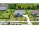 An aerial view showcasing the home, surrounding properties, and lush green landscape at 2839 Cordoba Ranch Blvd, Lutz, FL 33559