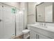 Well-lit bathroom featuring a glass shower, white cabinets, and modern fixtures at 2839 Cordoba Ranch Blvd, Lutz, FL 33559