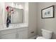 Tastefully decorated half bathroom with elegant fixtures and a stylish mirror at 2839 Cordoba Ranch Blvd, Lutz, FL 33559