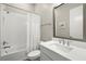 Well-lit bathroom featuring a shower/tub combo, modern fixtures, and a stylish vanity at 2839 Cordoba Ranch Blvd, Lutz, FL 33559