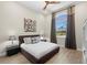 Comfortable bedroom with stylish decor, ceiling fan and large arched window at 2839 Cordoba Ranch Blvd, Lutz, FL 33559