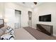 Well-lit bedroom featuring closet, wall mounted television and dresser at 2839 Cordoba Ranch Blvd, Lutz, FL 33559