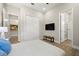 Bedroom with ensuite bathroom, TV, and closet with sliding doors at 2839 Cordoba Ranch Blvd, Lutz, FL 33559