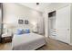 Bedroom showcasing artwork and a closet with sliding doors for storage at 2839 Cordoba Ranch Blvd, Lutz, FL 33559