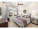Comfortable bedroom featuring a king-sized bed, decorative lamps, and neutral colors at 2839 Cordoba Ranch Blvd, Lutz, FL 33559