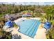 Beautiful community pool and splashpad surrounded by lush landscaping and inviting lounge areas at 2839 Cordoba Ranch Blvd, Lutz, FL 33559