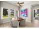 Cozy dining area with a round table, comfortable chairs, and natural light at 2839 Cordoba Ranch Blvd, Lutz, FL 33559