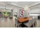 Spacious dining area with elegant chandelier, open layout to living area, and bar at 2839 Cordoba Ranch Blvd, Lutz, FL 33559