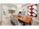 Bright dining room featuring a large wood table, white chairs, and modern decor with lots of natural light at 2839 Cordoba Ranch Blvd, Lutz, FL 33559