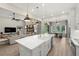 Spacious open-concept kitchen and living area with island, stainless appliances, and modern finishes at 2839 Cordoba Ranch Blvd, Lutz, FL 33559