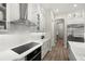 Modern kitchen with white cabinets, subway tile backsplash, and stainless steel appliances at 2839 Cordoba Ranch Blvd, Lutz, FL 33559