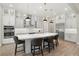 Bright kitchen with a large island, stainless steel appliances, and modern pendant lights at 2839 Cordoba Ranch Blvd, Lutz, FL 33559