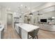 Modern kitchen with large island, stainless steel appliances, and open layout to the living area at 2839 Cordoba Ranch Blvd, Lutz, FL 33559