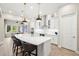 Bright, open kitchen featuring a large island, pendant lighting, and stainless steel appliances at 2839 Cordoba Ranch Blvd, Lutz, FL 33559