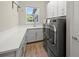 Well-equipped laundry room with modern appliances and ample counter space at 2839 Cordoba Ranch Blvd, Lutz, FL 33559