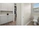 Laundry room with washer, dryer, folding space and a view to a walk-in closet at 2839 Cordoba Ranch Blvd, Lutz, FL 33559