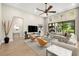 Bright living area featuring floor-to-ceiling windows, contemporary decor, and an open floor plan at 2839 Cordoba Ranch Blvd, Lutz, FL 33559