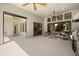 The covered outdoor space leads to a grilling area and scenic views of the property at 2839 Cordoba Ranch Blvd, Lutz, FL 33559