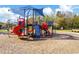 Community playground featuring slides, climbing structures, and shaded seating area at 2839 Cordoba Ranch Blvd, Lutz, FL 33559