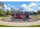 Community playground with climbing structures, slides, and covered seating for a fun outdoor experience at 2839 Cordoba Ranch Blvd, Lutz, FL 33559