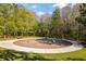 Community playground with colorful spring riders and seating area surrounded by natural wooded landscape at 2839 Cordoba Ranch Blvd, Lutz, FL 33559