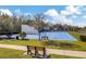 Bright blue community tennis and racquetball courts surrounded by green landscaping and seating at 2839 Cordoba Ranch Blvd, Lutz, FL 33559