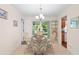 Cozy dining area featuring a glass table and rattan chairs at 2875 Lomond Dr, Palm Harbor, FL 34684