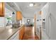 Bright kitchen featuring wooden cabinets, stainless steel appliances, and a spacious countertop at 2875 Lomond Dr, Palm Harbor, FL 34684