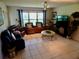 Spacious living room bathed in natural light, offering a comfortable area for relaxation and entertainment at 29413 Caddyshack Ln, San Antonio, FL 33576