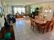 Spacious living room with a dining room, perfect for relaxation and entertaining, bathed in natural light at 29413 Caddyshack Ln, San Antonio, FL 33576
