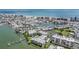 Daytime aerial view of the condo complex and the neighborhood near the water and beaches at 399 150Th Ave # 315, Madeira Beach, FL 33708