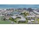 Aerial shot of the condo complex and neighborhood near the water on a sunny day at 399 150Th Ave # 315, Madeira Beach, FL 33708