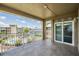 View of the marina, the building, the pool, and the sky from the tiled balcony at 399 150Th Ave # 315, Madeira Beach, FL 33708