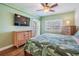 Bedroom featuring hardwood floors, and sliding glass doors that lead to a balcony at 399 150Th Ave # 315, Madeira Beach, FL 33708