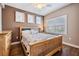 Bedroom featuring hardwood floors, a ceiling fan, and shutters on the window at 399 150Th Ave # 315, Madeira Beach, FL 33708