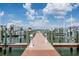 Dock features boat lifts and a stunning view of the water and sky at 399 150Th Ave # 315, Madeira Beach, FL 33708