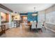 Open-concept dining room adjacent to the kitchen, featuring modern furnishings and stylish decor at 399 150Th Ave # 315, Madeira Beach, FL 33708
