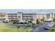 Exterior of building with covered parking, balconies, and well-maintained landscaping in a desirable neighborhood at 399 150Th Ave # 315, Madeira Beach, FL 33708