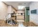 Bright kitchen featuring light wood cabinetry, granite countertops, and stainless-steel appliances at 399 150Th Ave # 315, Madeira Beach, FL 33708